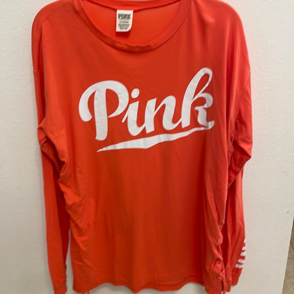 Pink Victoria’s Secret long sleeve top with ties on the side